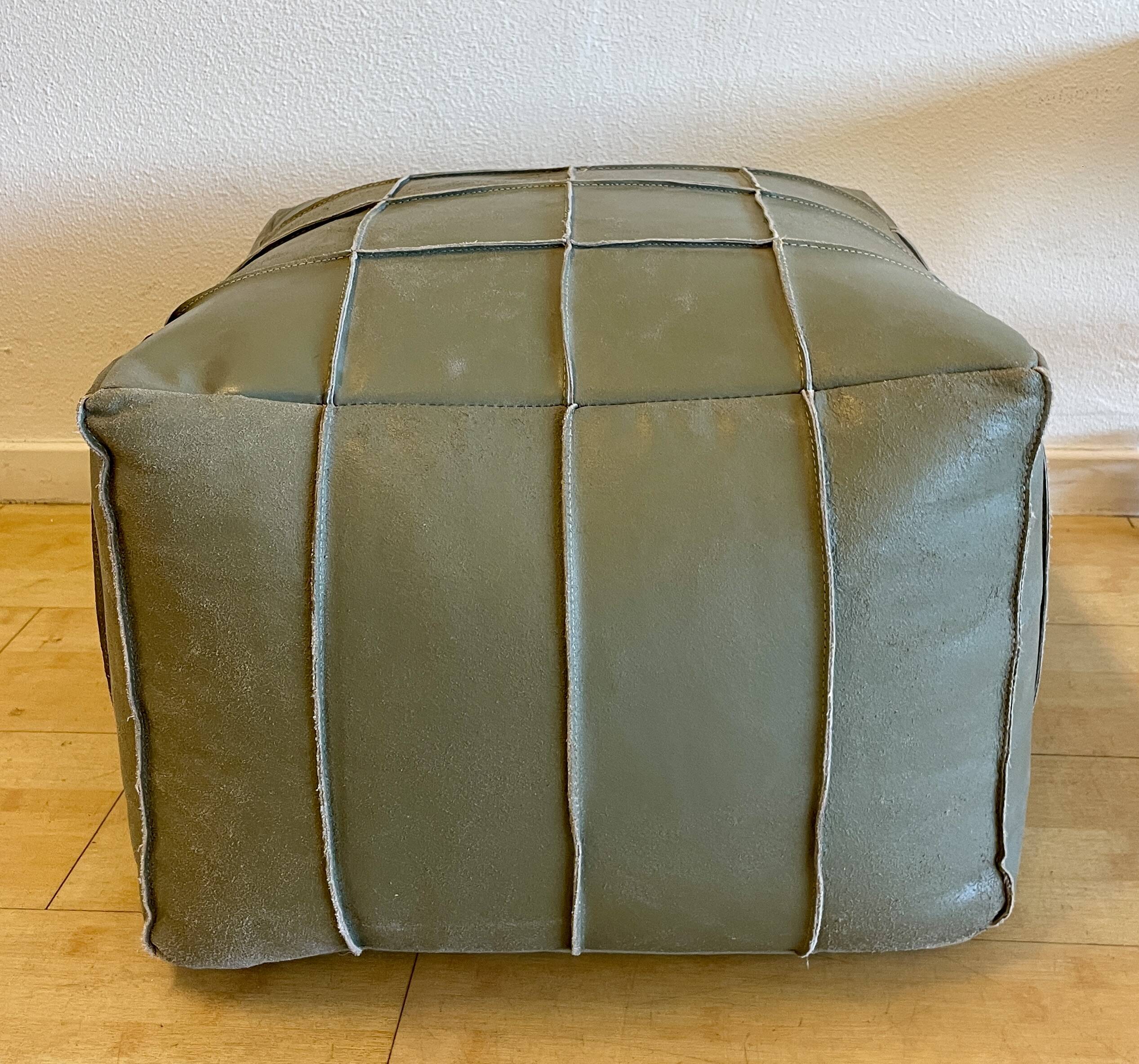 Grey leather pouf