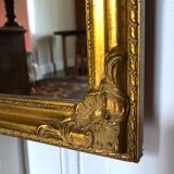 Old slim golden mirror