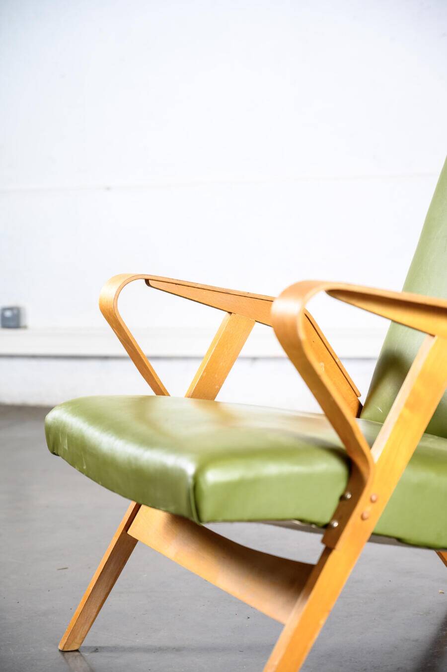 Fauteuil en skaï vert