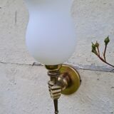 Hand-to-torch wall lamp