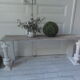 Bench, bed end on pearl grey patinated wheels, powder white, bleached wood seat