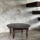 Coffee table, round antique Indonesian teak table with straight legs.