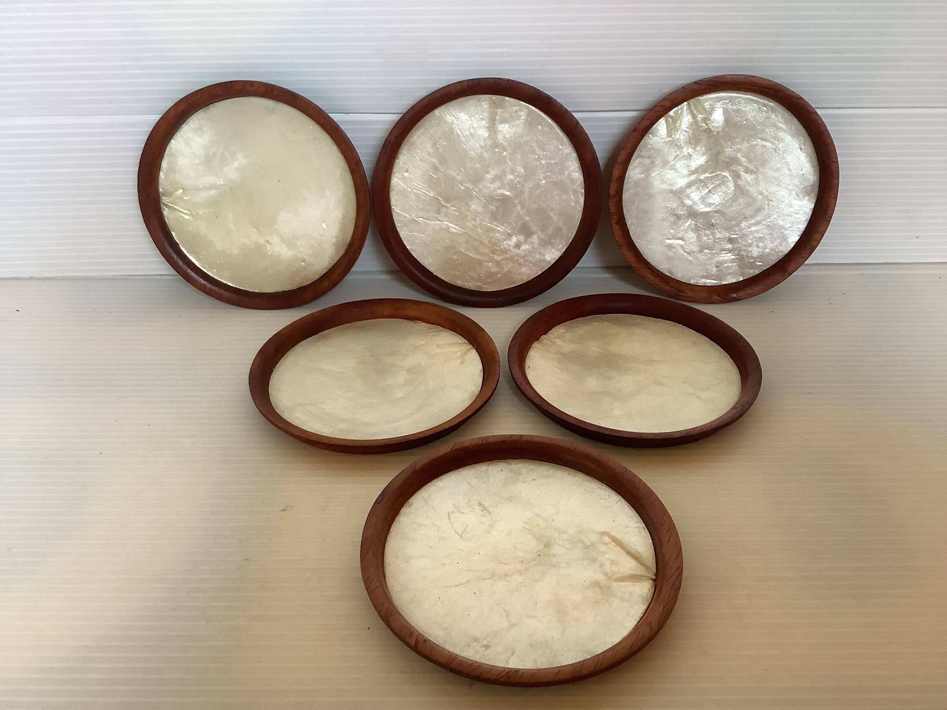 Six mother-of-pearl teak wood coasters