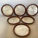 Six mother-of-pearl teak wood coasters
