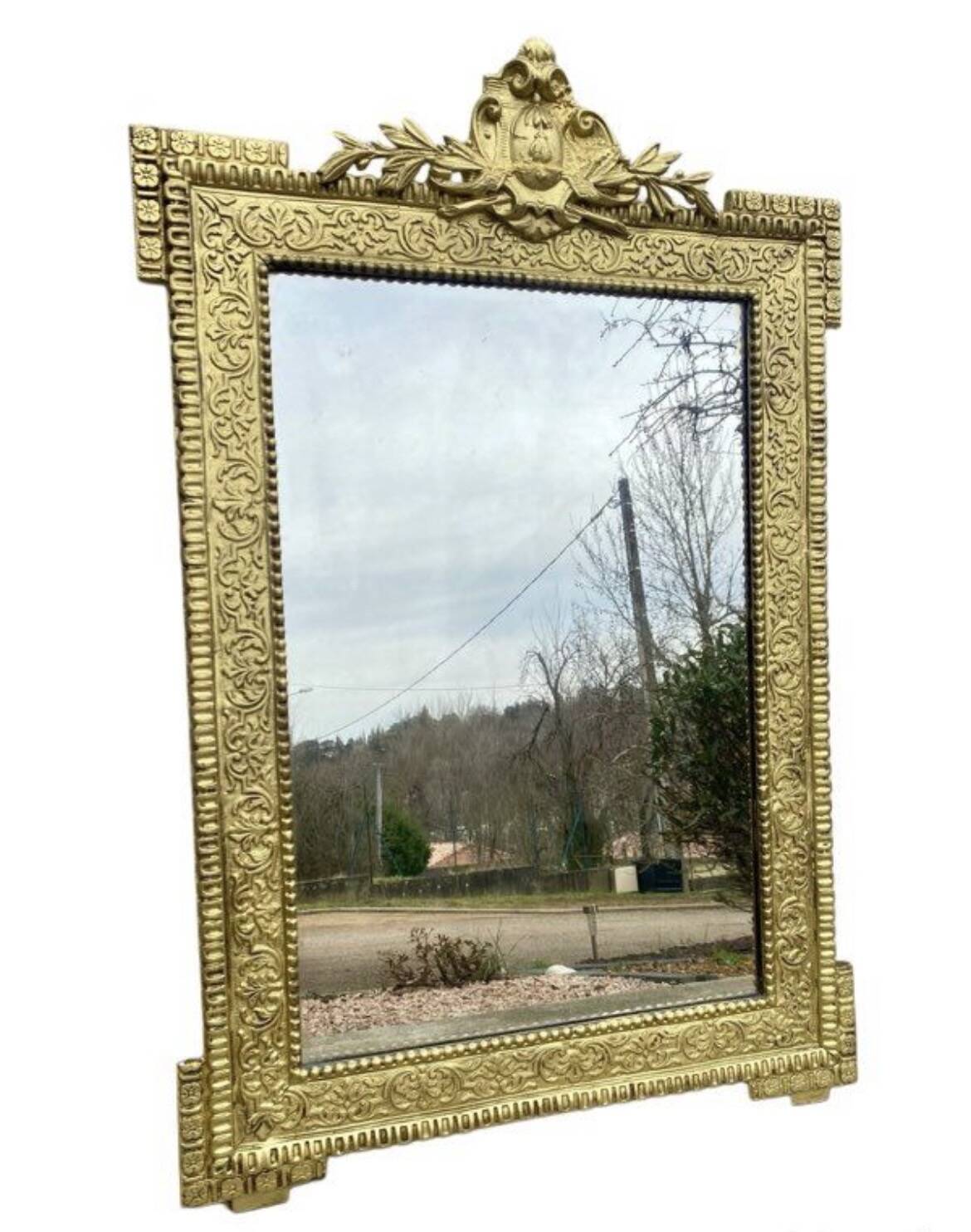 19th-century antique mirror in carved gilded wood, Napoleon style.