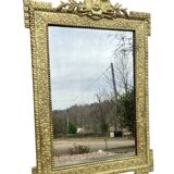 19th-century antique mirror in carved gilded wood, Napoleon style.