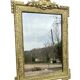 19th-century antique mirror in carved gilded wood, Napoleon style.
