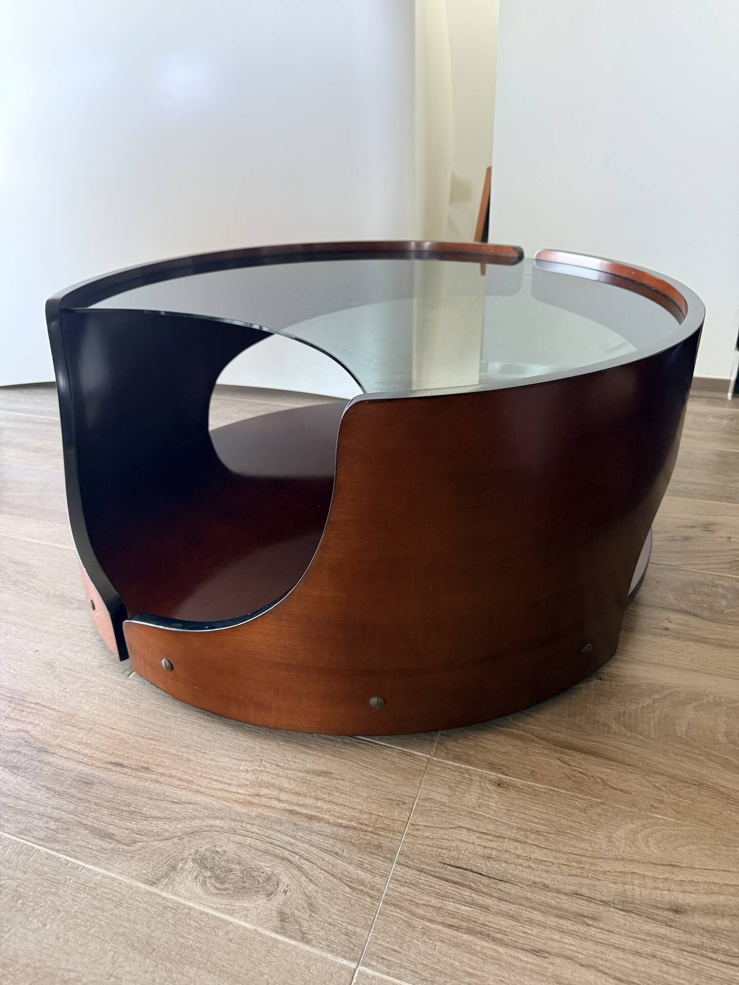 Italian Space Age coffee table in curved wood and smoked glass – 1970s