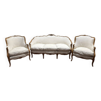 Beige Louis XV style salon sofa and pair of armchairs.