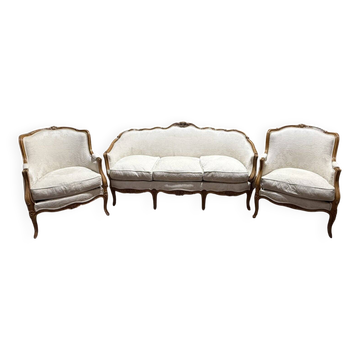 Beige Louis XV style salon sofa and pair of armchairs.