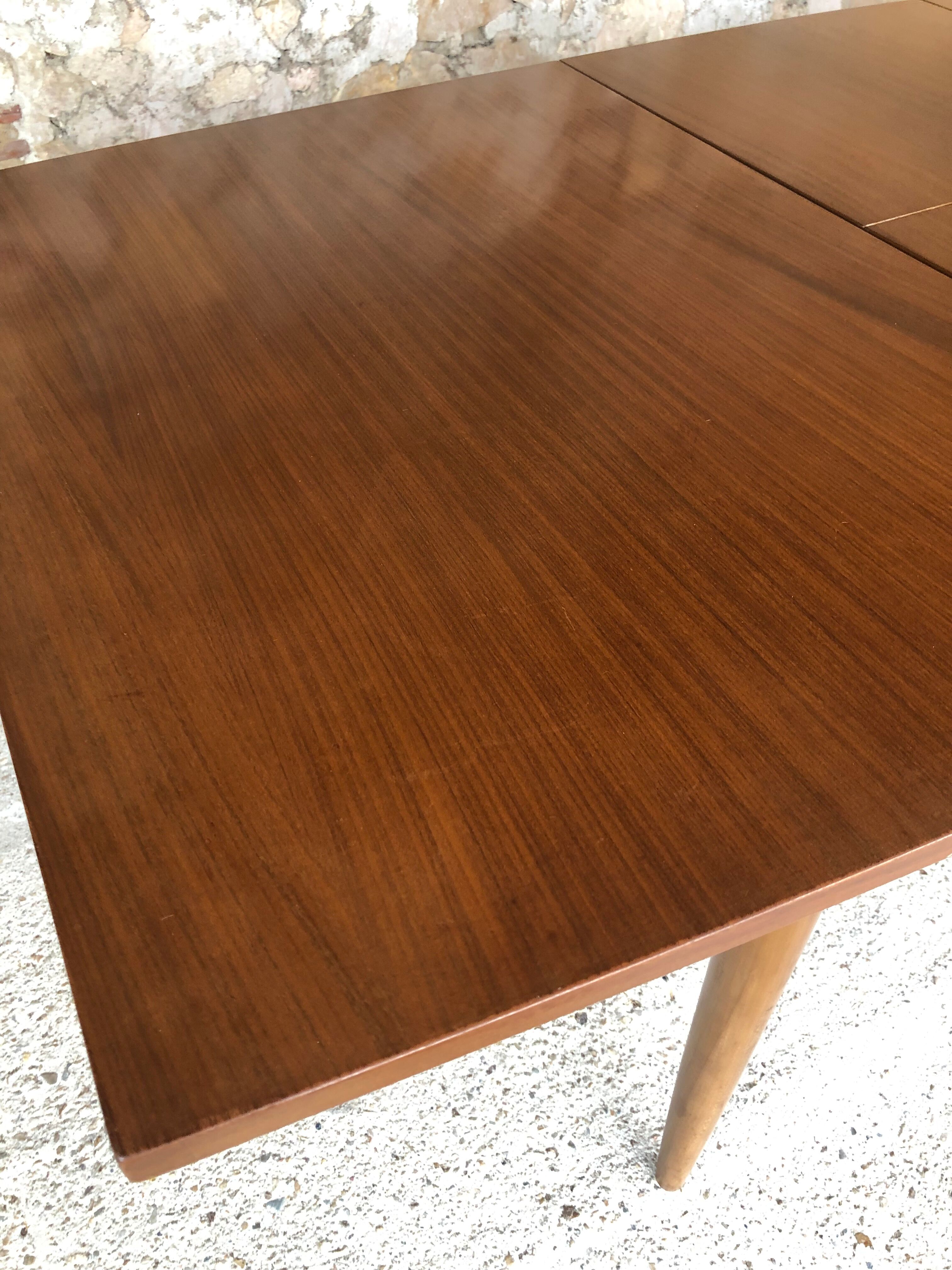 Scandinavian extension teak stretch table in butterfly ephardt by Meredew circa 60's