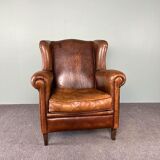 Vintage armchair in patinated sheep leather