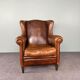 Fauteuil vintage en cuir de mouton patiné