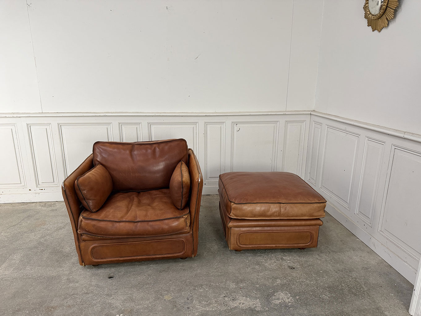 Club armchair and its ottoman 1980s