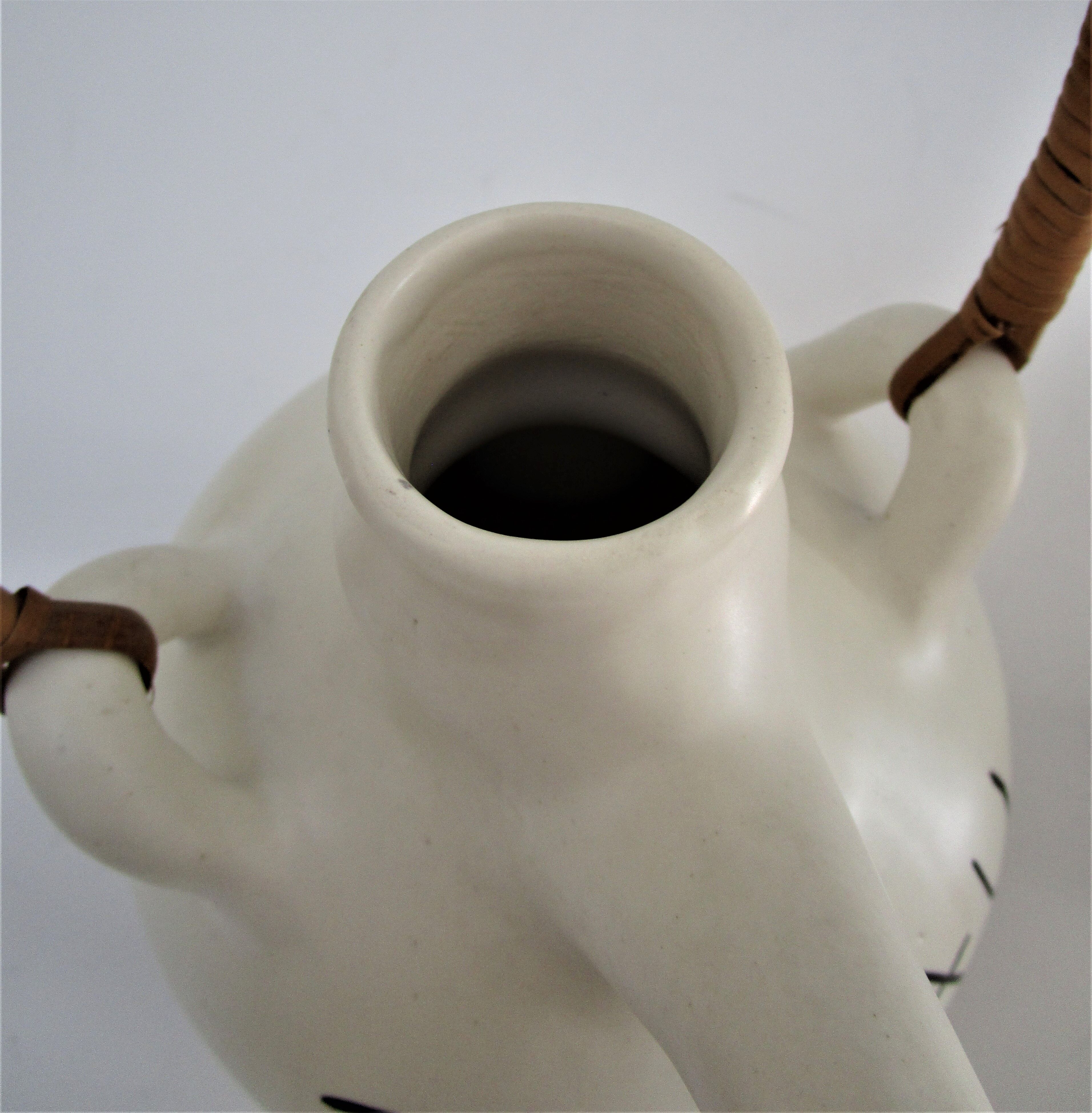 pineau bottle and ceramic cup by Lili Voltz 60s