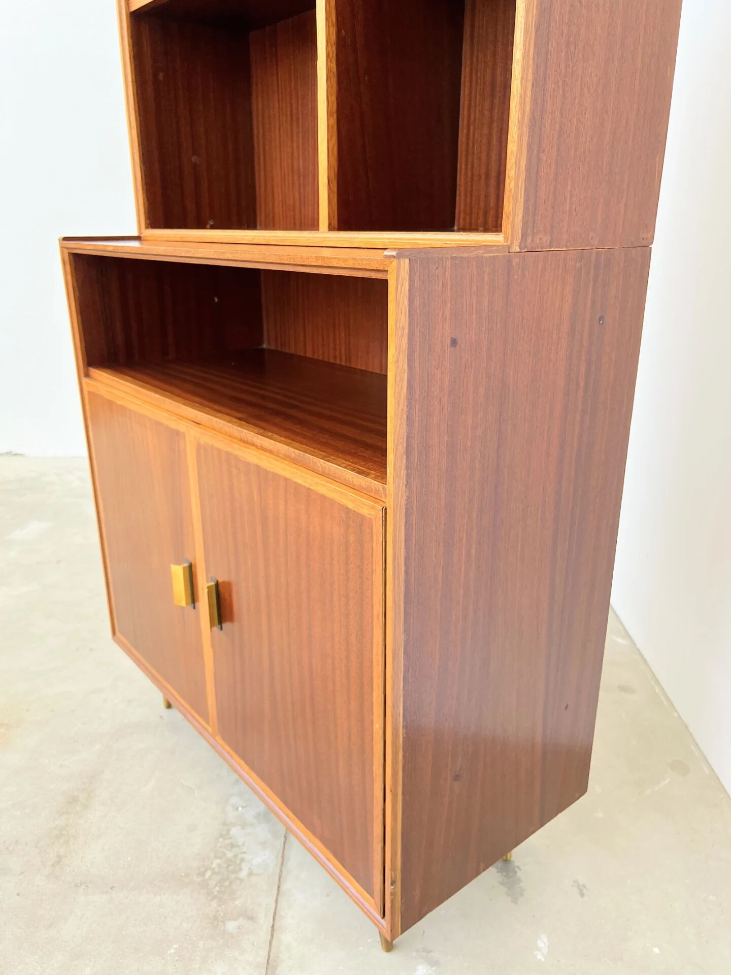 Mahogany library — closed storage and open cubbies, custom-made, 1960s.