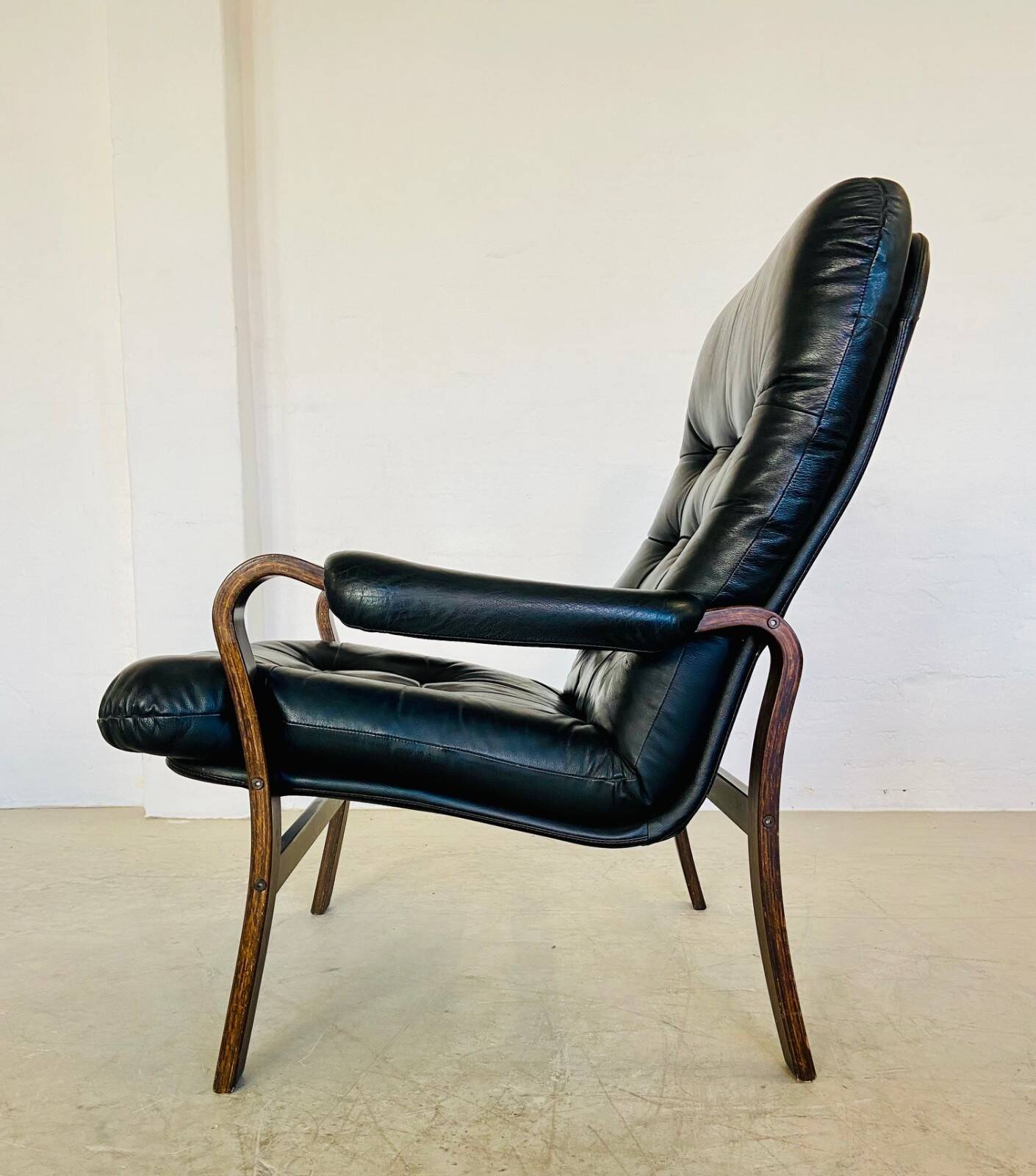 Vintage mid-century Scandinavian black leather lounge chair 1970s
