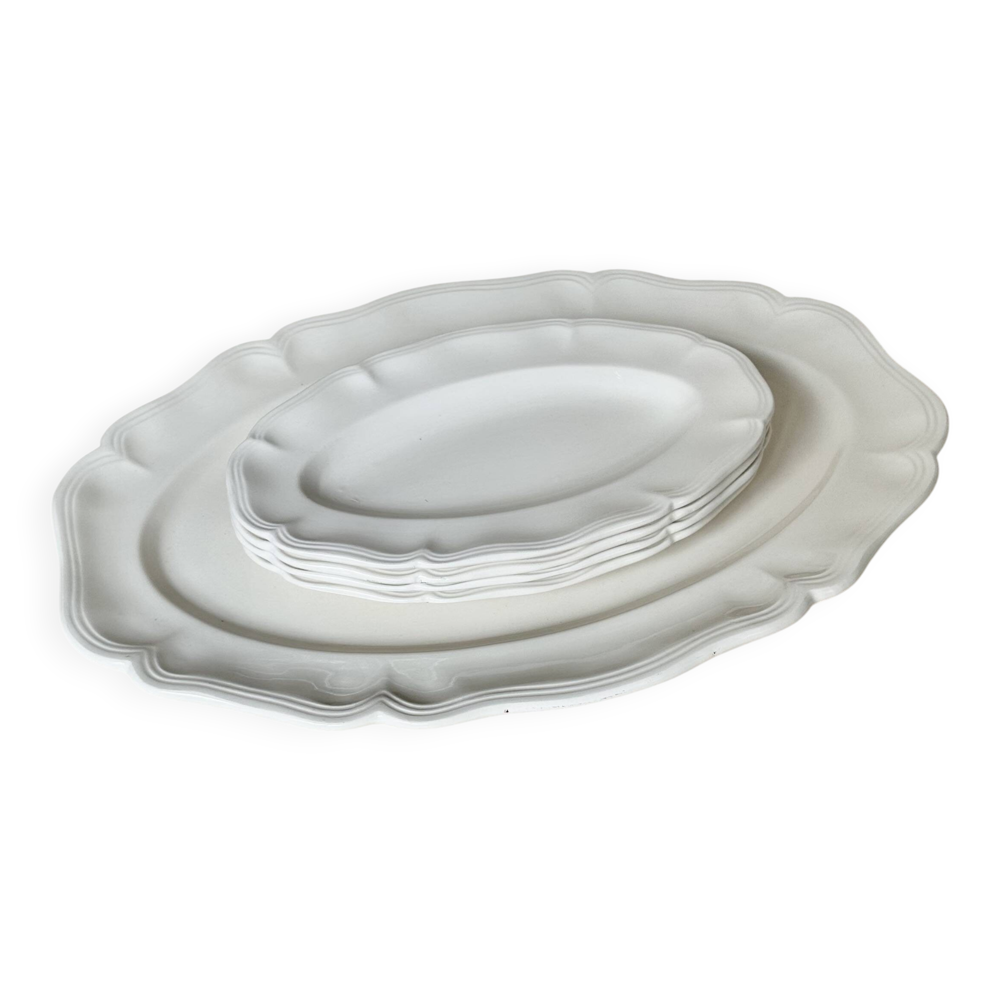 Shaped plates and dishes in Sarreguemines earthenware.