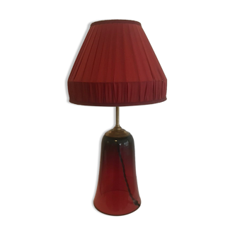 Red tinted glass lamp with pleated lampshade
