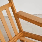 Brutalist armchair in oak and leather by Tage Poulsen, Denmark, 1970s.