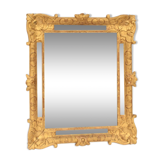 Mirror with parcloses in gilded wood