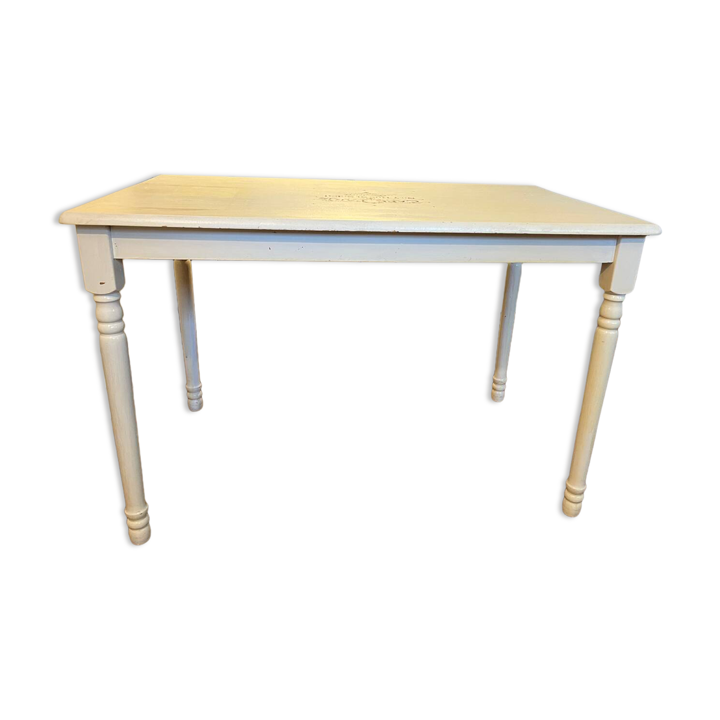 Farm table with a cream patina.