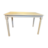 Farm table with a cream patina.