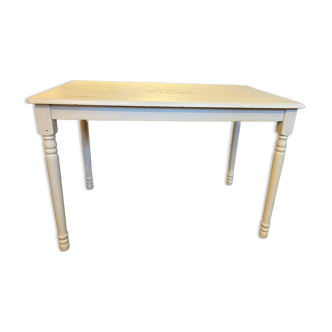 Farm table with a cream patina.