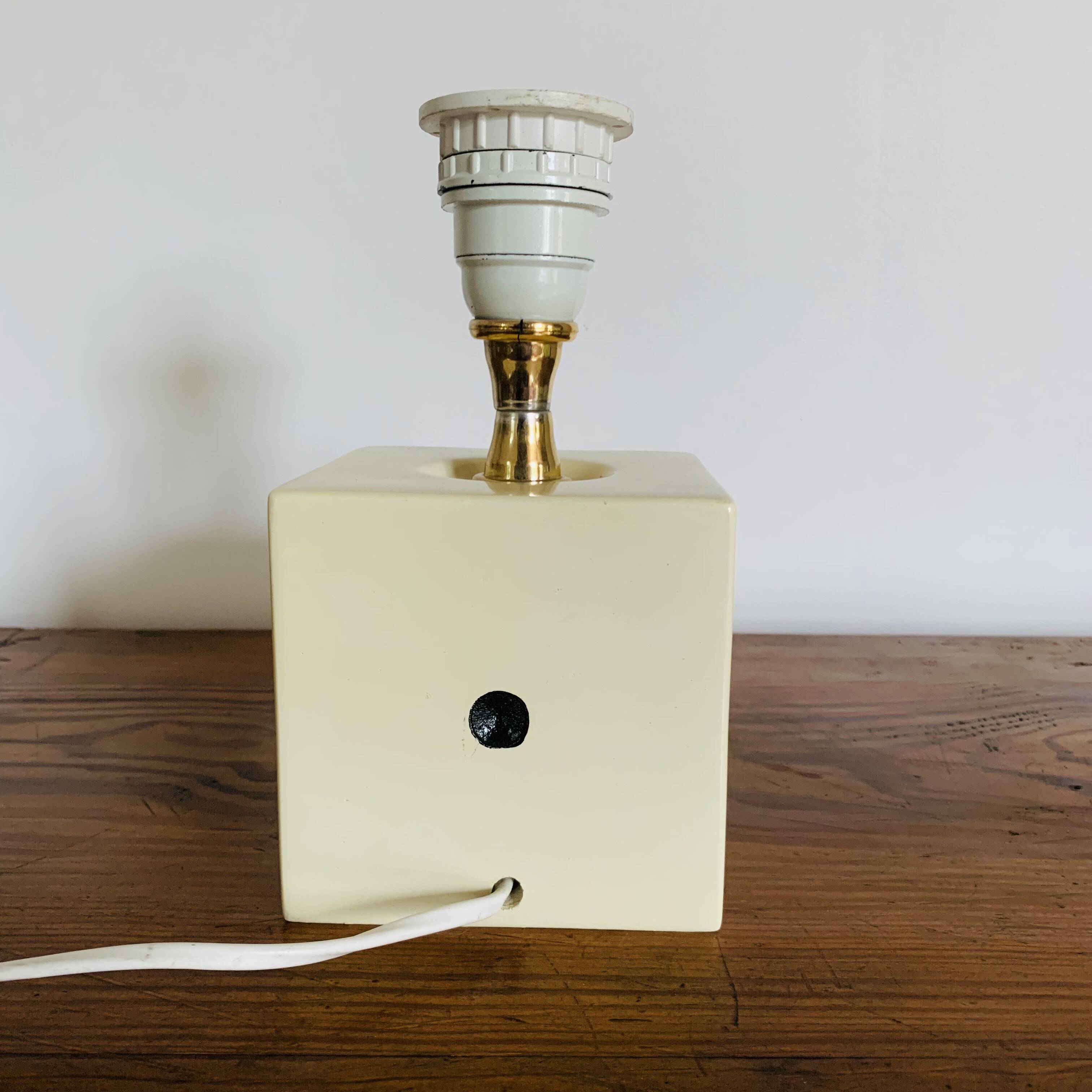 Lamp base representing a die