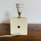 Lamp base representing a die