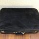 Former skai black travel suitcase