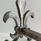 Pair of vintage steel fleur-de-lys andirons