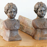 Pair of cast iron chenets, Love victorious