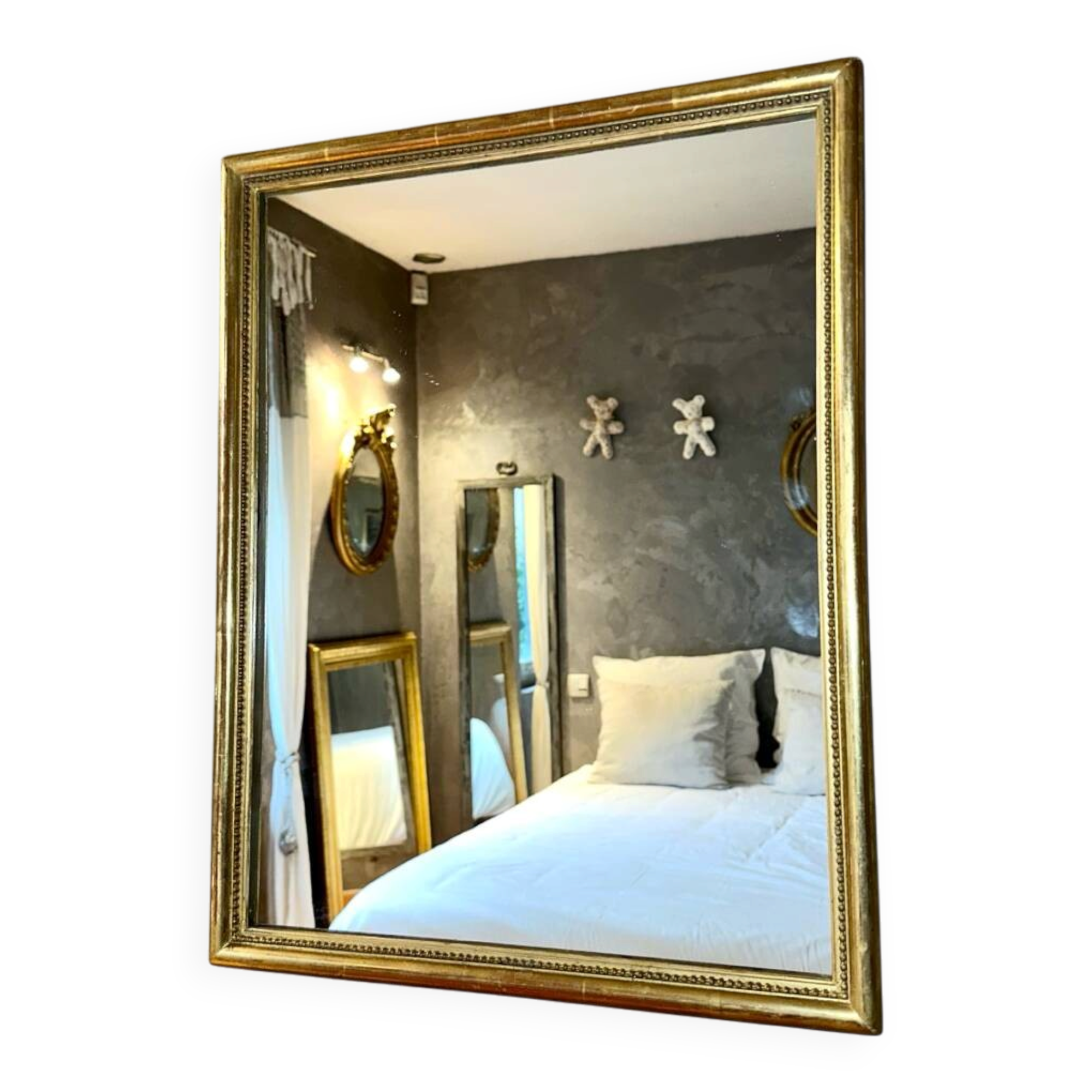 Antique gilded mirror with pearl and gold leaf.