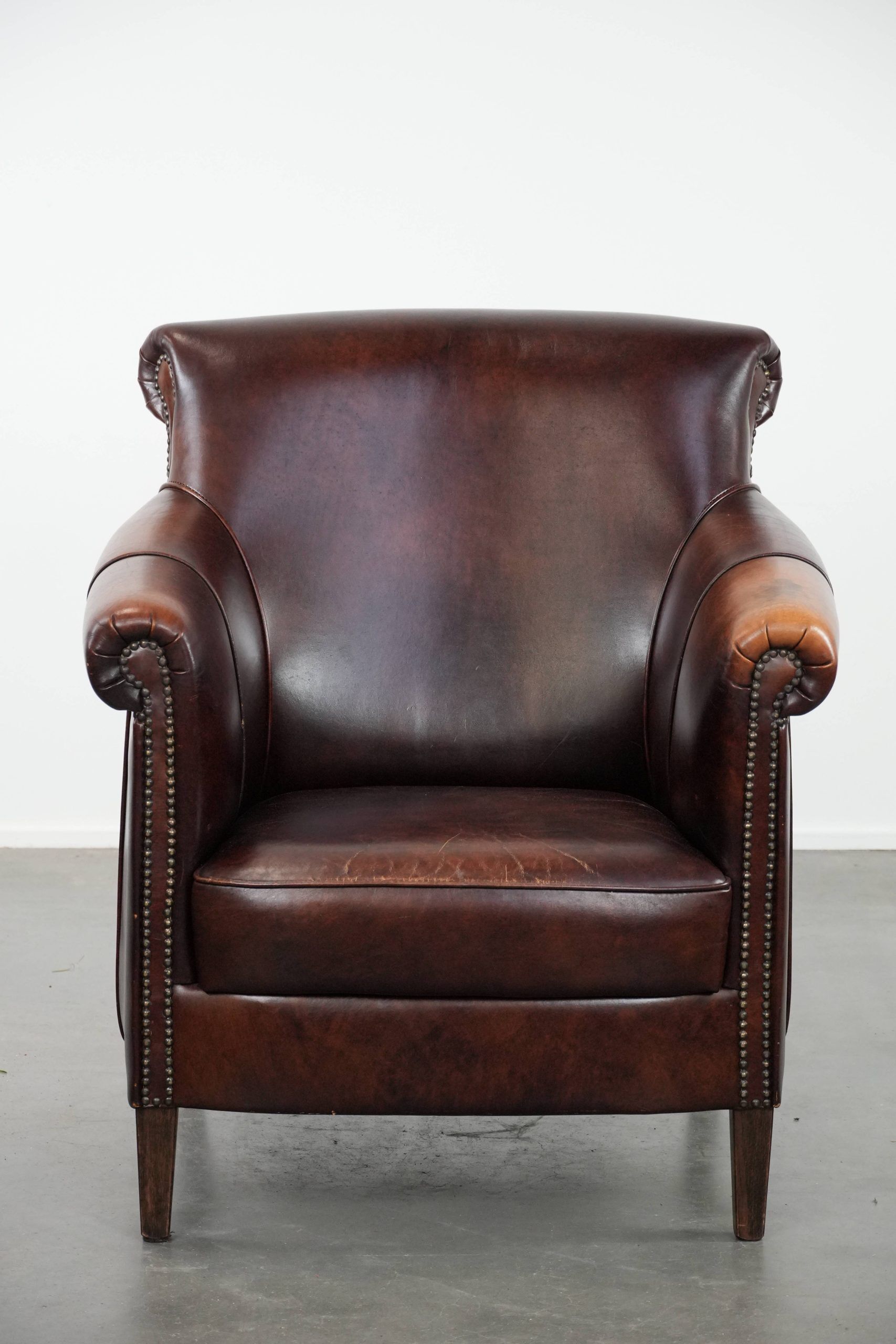 Characterful and comfortable cowhide leather armchair