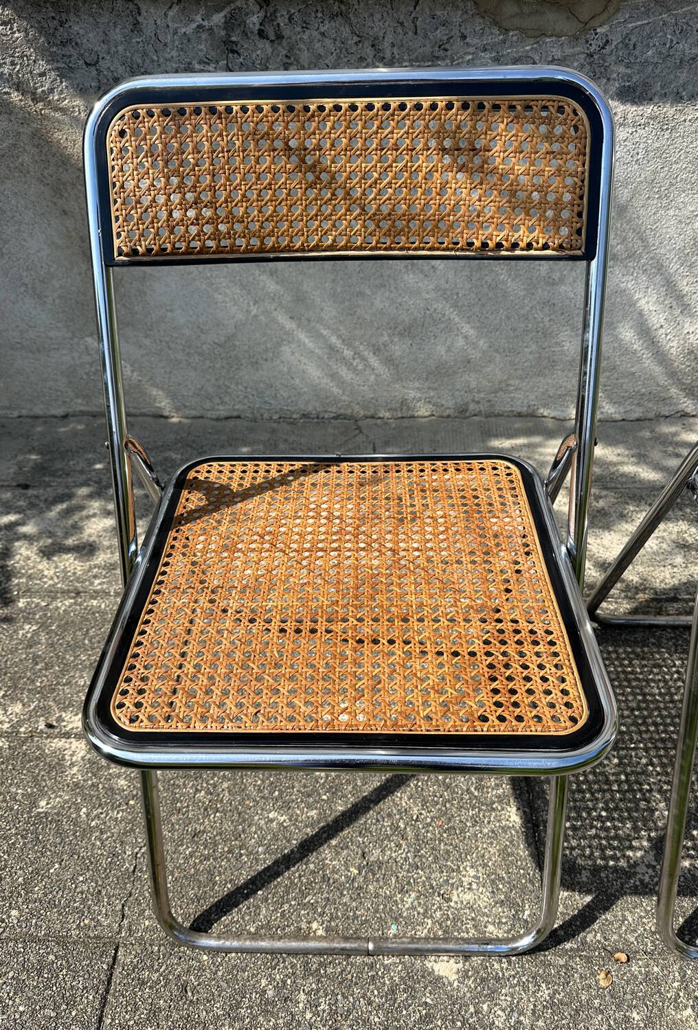 Pair of vintage metal caned folding chairs