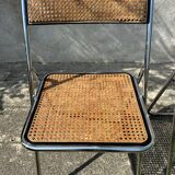 Pair of vintage metal caned folding chairs