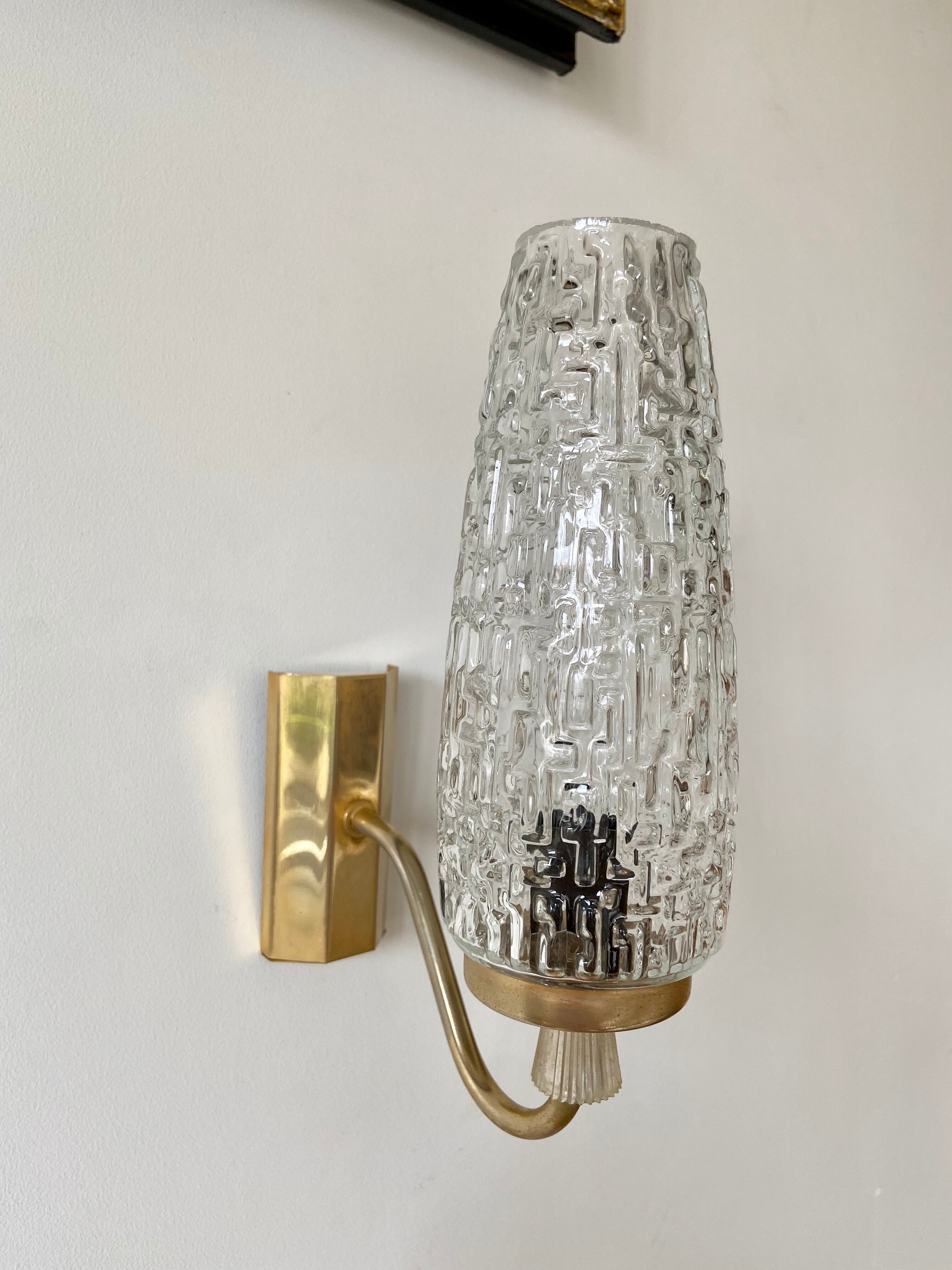 Gold metal and chiseled glass wall sconce