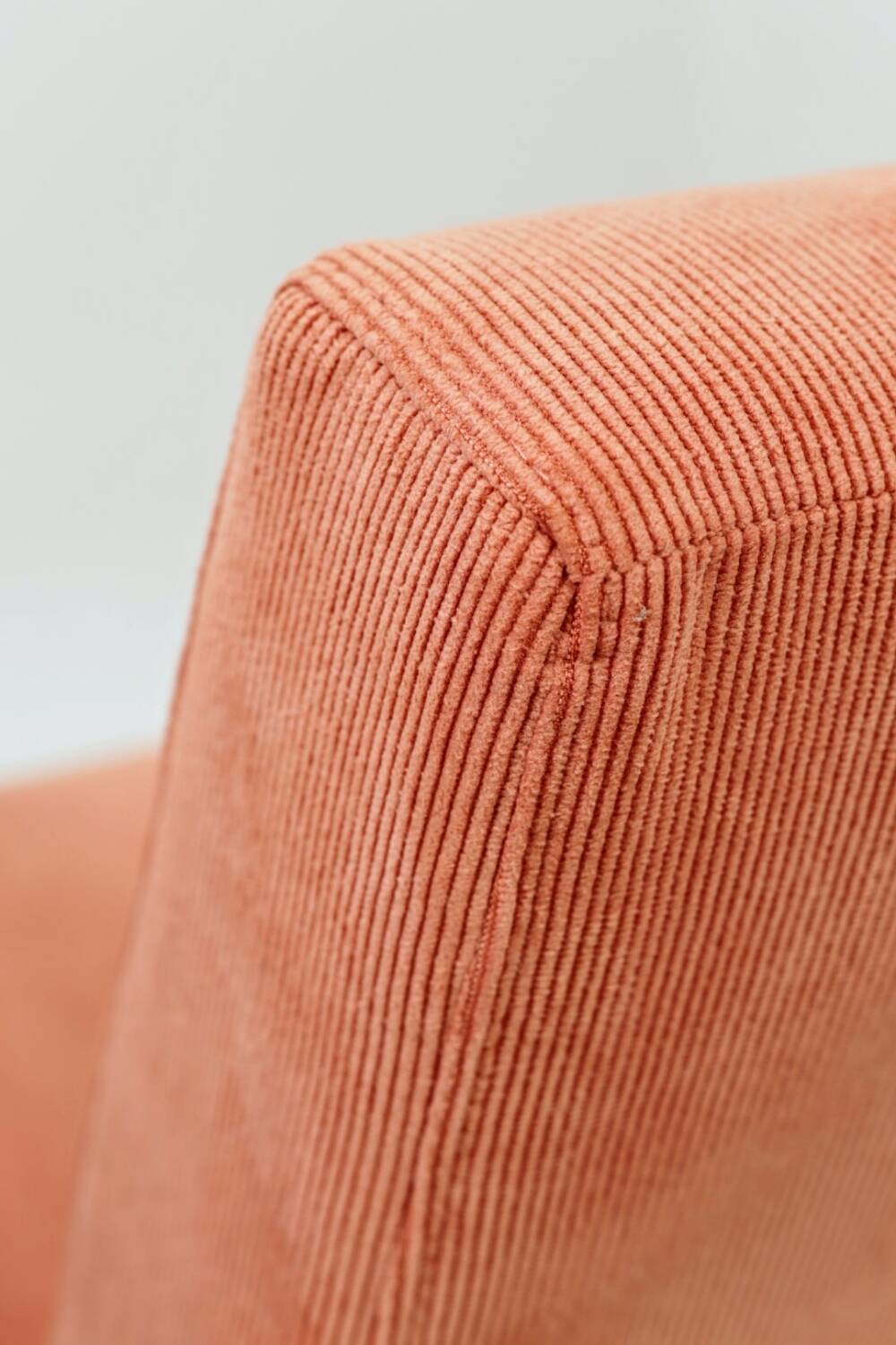 Mid-century modern armchair in coral red designed by H. Lis.