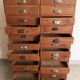 Old apothecary trade furniture in vintage wood 24 drawers.