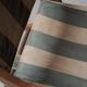 Foldable chair in solid wood and striped fabric, circa 1900.