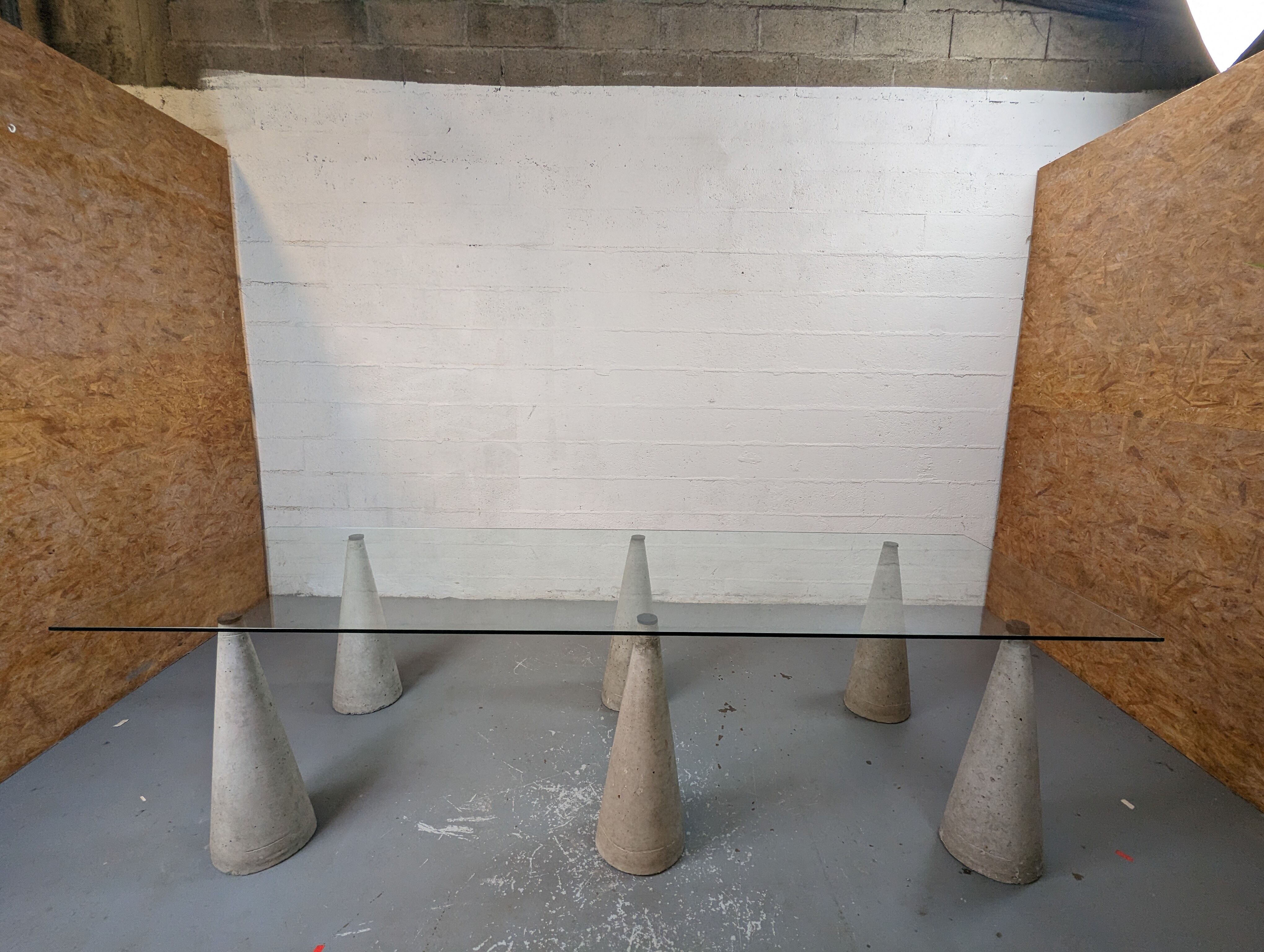 Glass table with cement legs