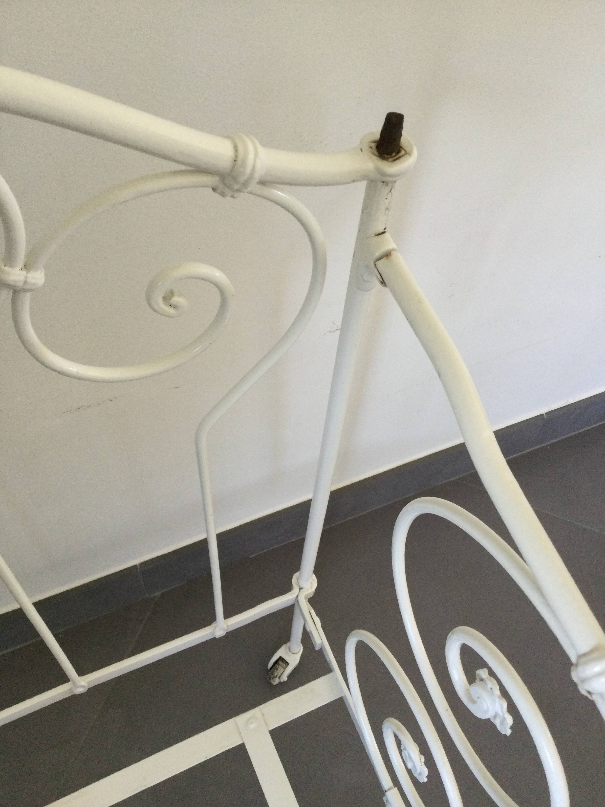 White wrought iron folding bed