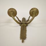 Pair of two-armed Empire wall sconces in gilded bronze