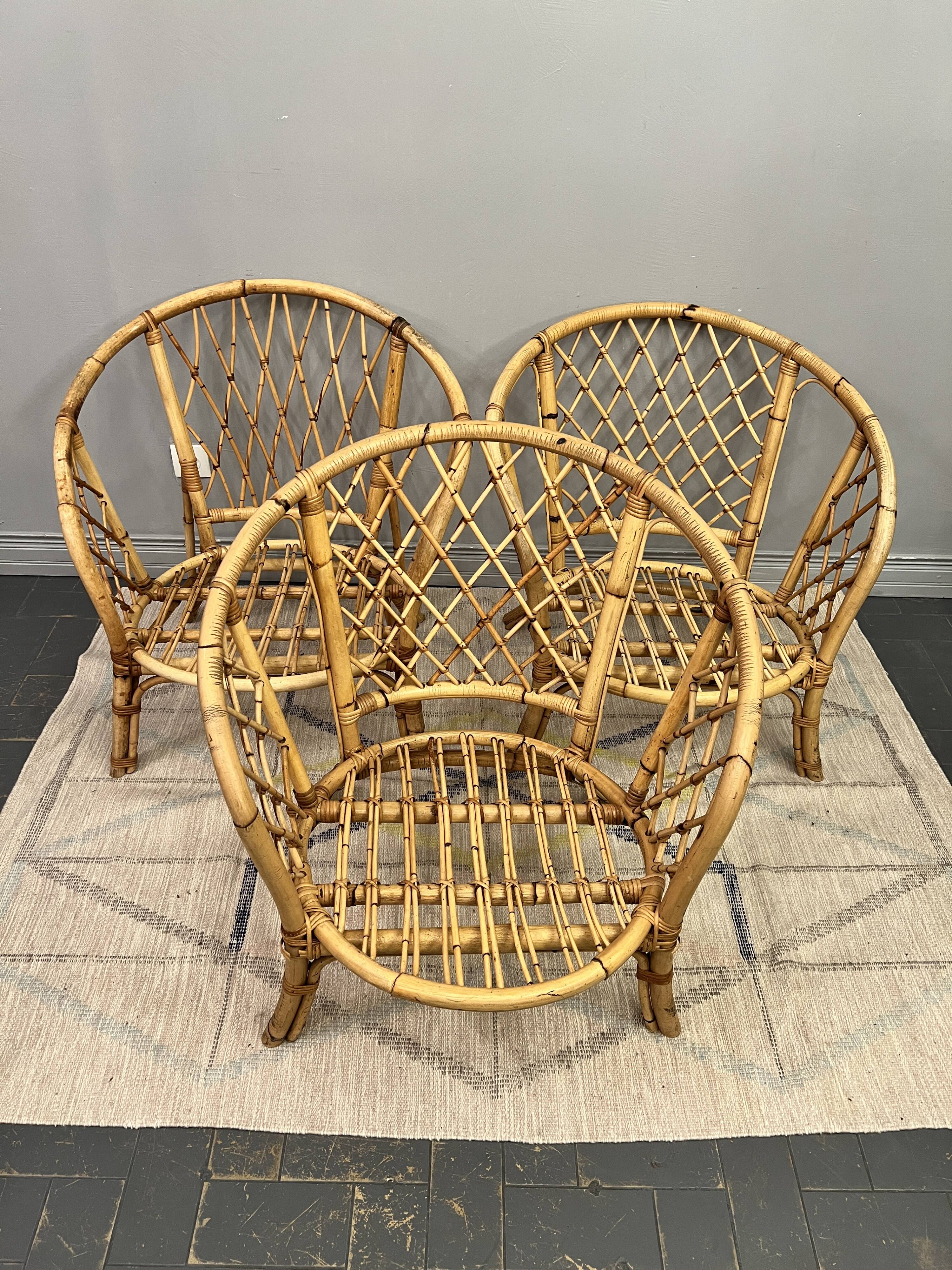 Trio of rattan armchairs