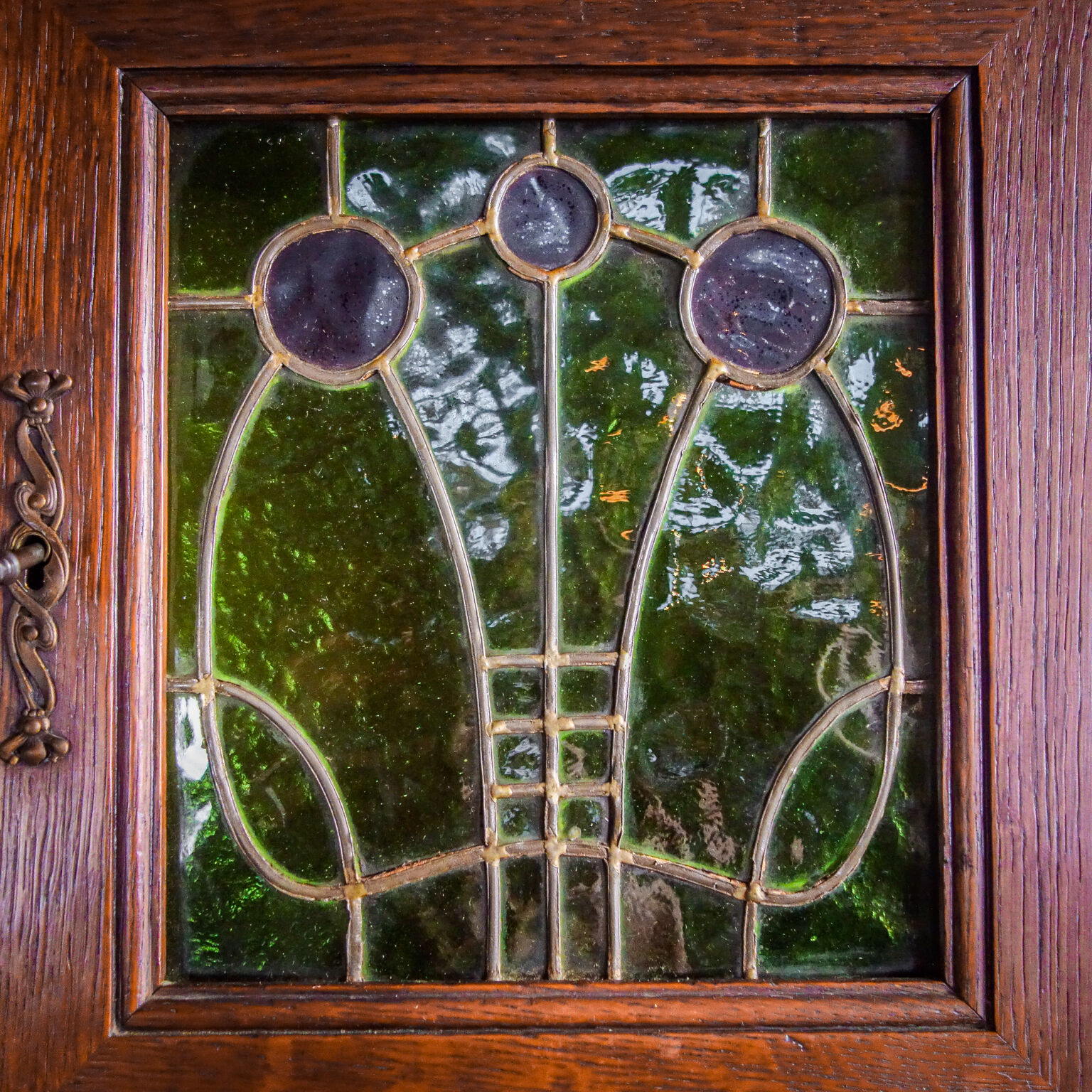 art nouveau cabinet with stained glass window, France circa 1910