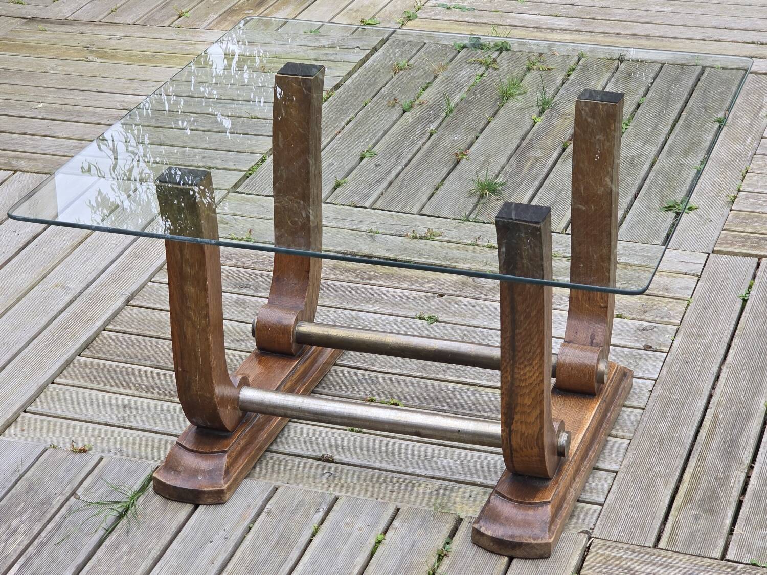 Art Deco coffee table in glass, wood, and brass.
