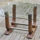 Art Deco coffee table in glass, wood, and brass.