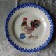 18th century decorative plate in Saint Clement earthenware signed with rooster decoration