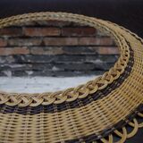 Vintage round mirror in a wicker frame
